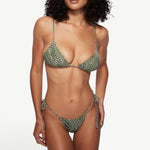 KABE SHOP INC Equator triangle bikini top in olive green with white abstract print, worn by a model with a sun hat.