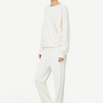 KABE SHOP INC ÉTERNE cream French terry sweatpants and matching sweatshirt worn by a model in a relaxed fit