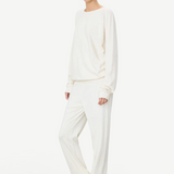KABE SHOP INC ÉTERNE cream French terry sweatpants and matching sweatshirt worn by a model in a relaxed fit