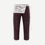 KABE SHOP INC Gianna pants in black with white polka dots, featuring a decorative white crochet waist detail.