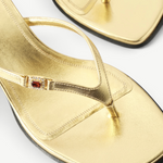 KABE SHOP INC Dona Ruby 55 gold metallic leather thong mule sandal with a red jewel accent on the toe strap