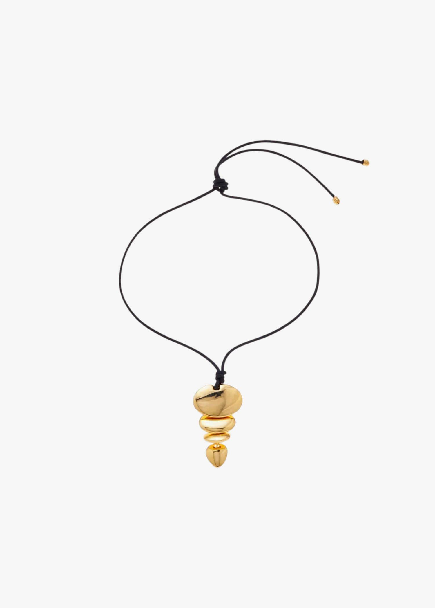 KABE SHOP INC gold sculptural pendant necklace with an adjustable black cord and stacked metallic shapes