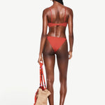KABE SHOP INC Infinity Top in terracotta, a sculpting bikini top worn by a model from the back view.