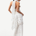 Model wearing a white KABE SHOP INC Katinka skirt featuring intricate crochet and lace patchwork in a fitted style.