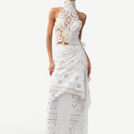 Model wearing a KABE SHOP INC Katinka white cotton skirt with intricate crochet and lace patchwork details.