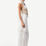 Model wearing KABE SHOP INC Katinka white cotton skirt with intricate crochet and lace patchwork details