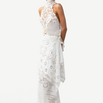 Model wearing a KABE SHOP INC Katinka white cotton skirt with intricate crochet and lace patchwork details.