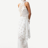 Model wearing a KABE SHOP INC Katinka white cotton skirt with intricate crochet and lace patchwork details.