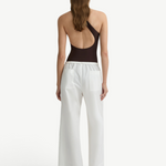 KABE SHOP INC Kyoto white wide leg cotton pants worn by a model from the back view with a dark brown bodysuit.
