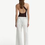KABE SHOP INC Kyoto white wide leg cotton pants worn by a model from the back view with a dark brown bodysuit.