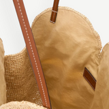 KABE SHOP INC large palm raffia bag with tan leather straps and a beige fabric interior lining