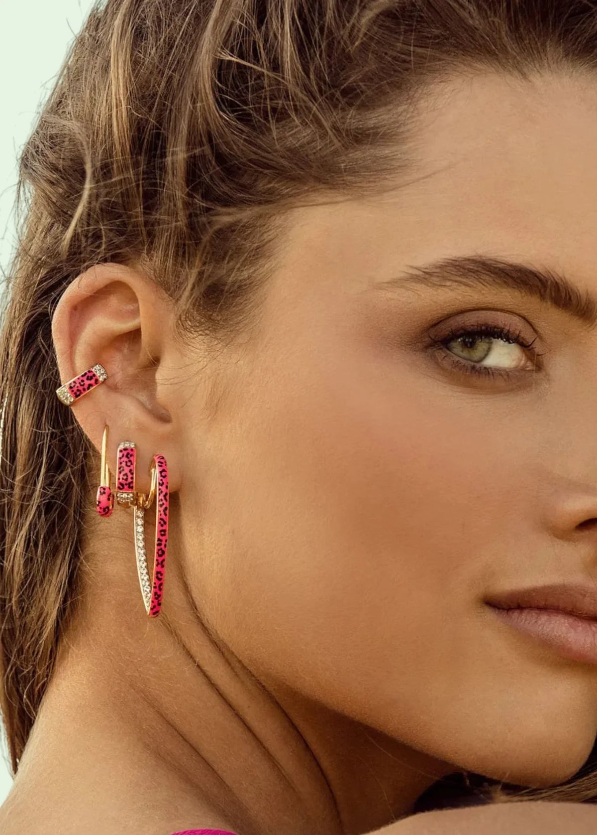 KABE SHOP INC zirconia leopard print ear cuff and matching earrings worn on a model with pink enamel accents