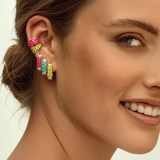 KABE SHOP INC single rectangular leopard print enamel earrings with zirconia accents worn by a smiling woman