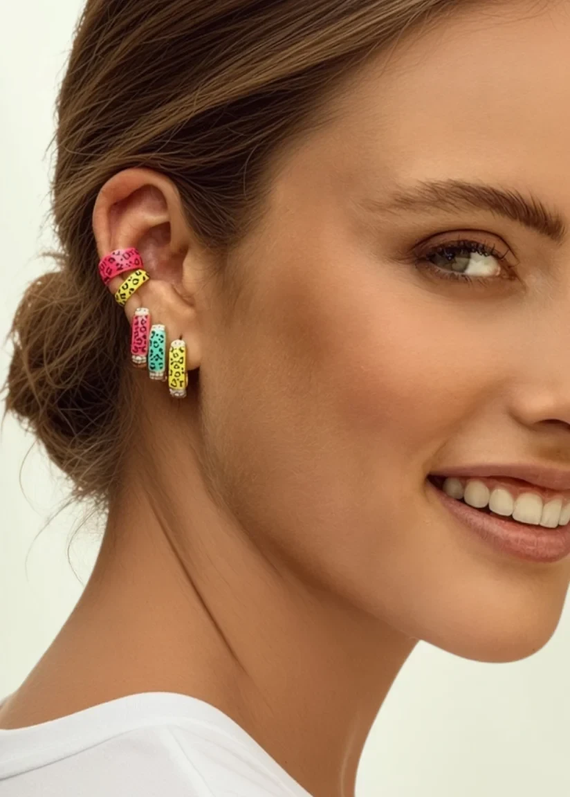 KABE SHOP INC single rectangular leopard print enamel earrings with zirconia accents worn by a smiling woman