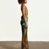 KABE SHOP INC Magdalena long silk maxi dress with halter neckline and abstract landscape print on a model side view