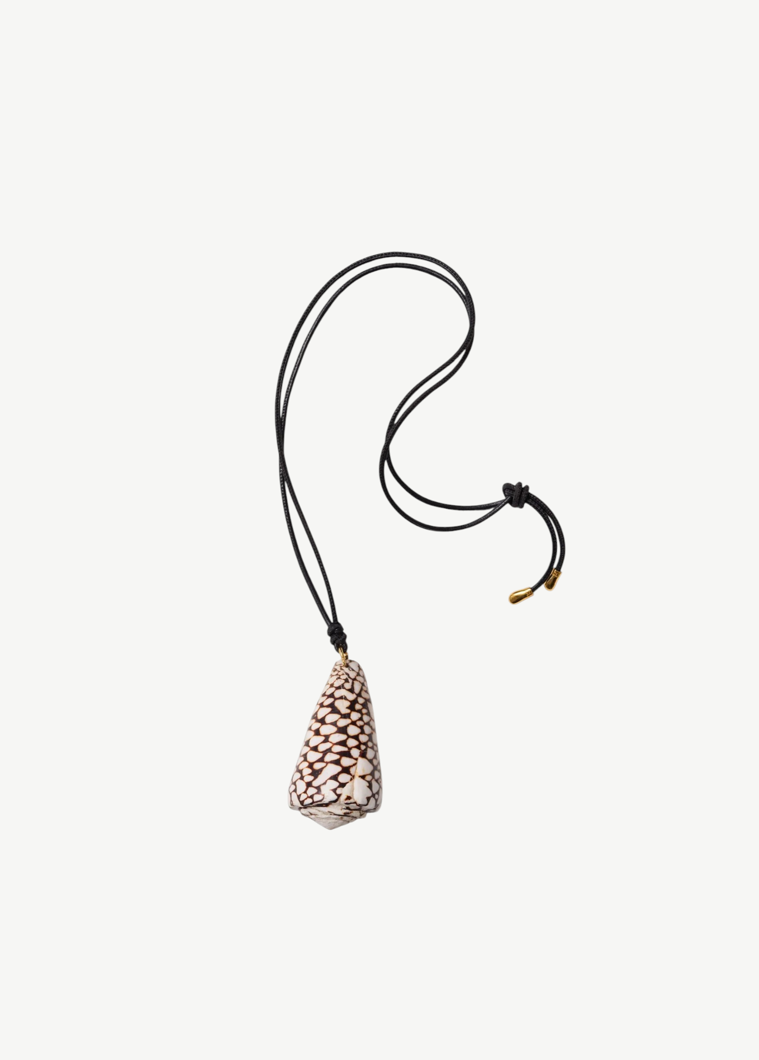 KABE SHOP INC marble cone shell pendant necklace on a black leather cord with gold-capped adjustable knot ends.