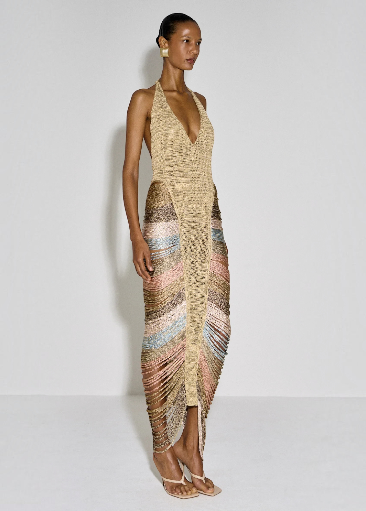 KABE SHOP INC Melissa dress featuring a beige halter neckline, intricate cord detailing, and a multi-colored fringe hem
