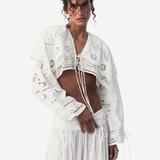 KABE SHOP INC Menorca trousers in white cotton with intricate lace detailing worn by a model in a studio setting