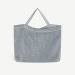 KABE SHOP INC Deiji Studios metallic silver knit shoulder bag with an organic cotton drawstring pouch interior.