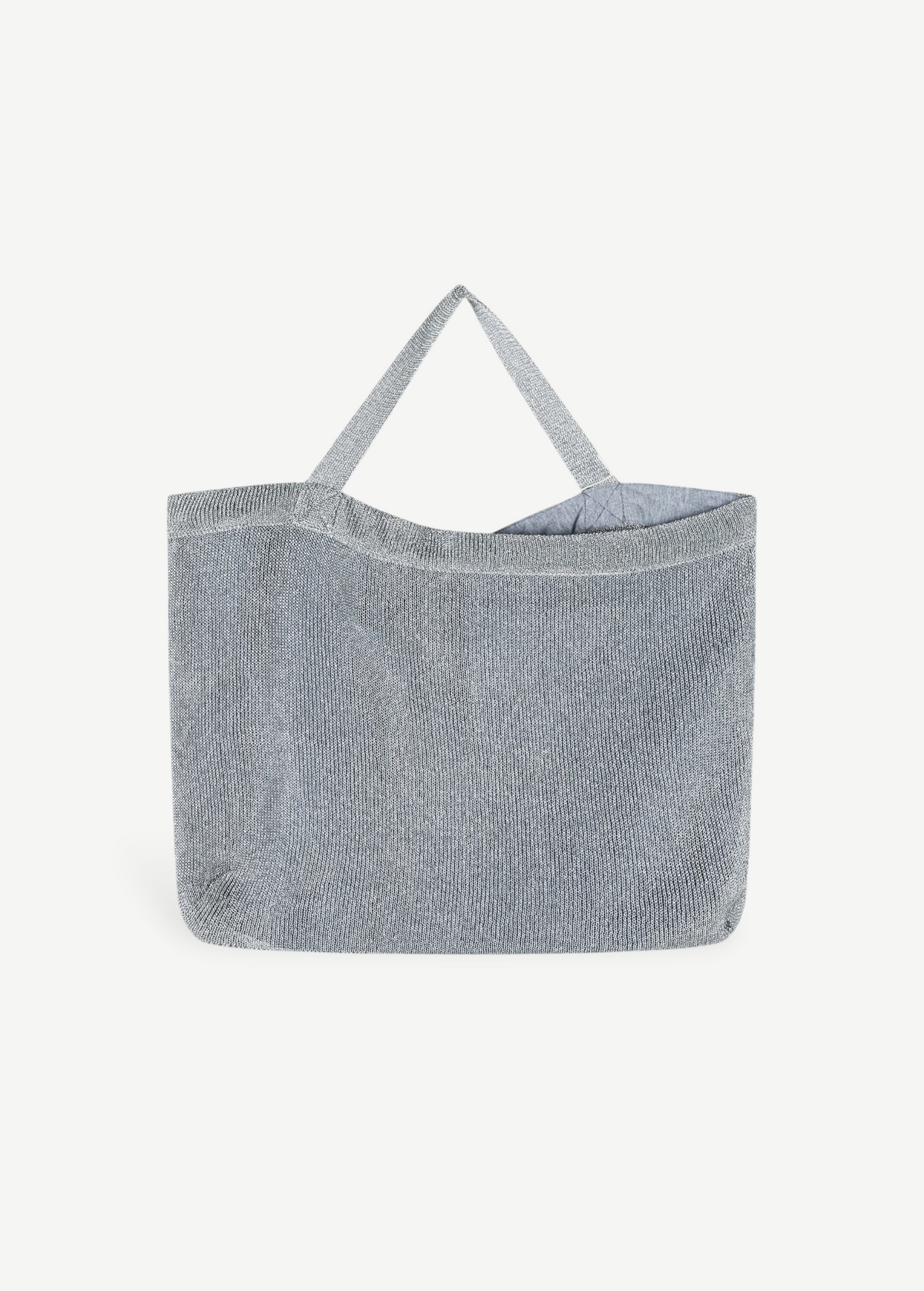 KABE SHOP INC Deiji Studios metallic silver knit shoulder bag with an organic cotton drawstring pouch interior.
