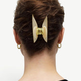 KABE SHOP INC Midi Heirloom Claw in cream Italian acetate worn in brown hair, showing a double-walled design.