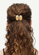 KABE SHOP INC mini claw hair clip in beige Italian bio-acetate holding curly hair in a half-up style
