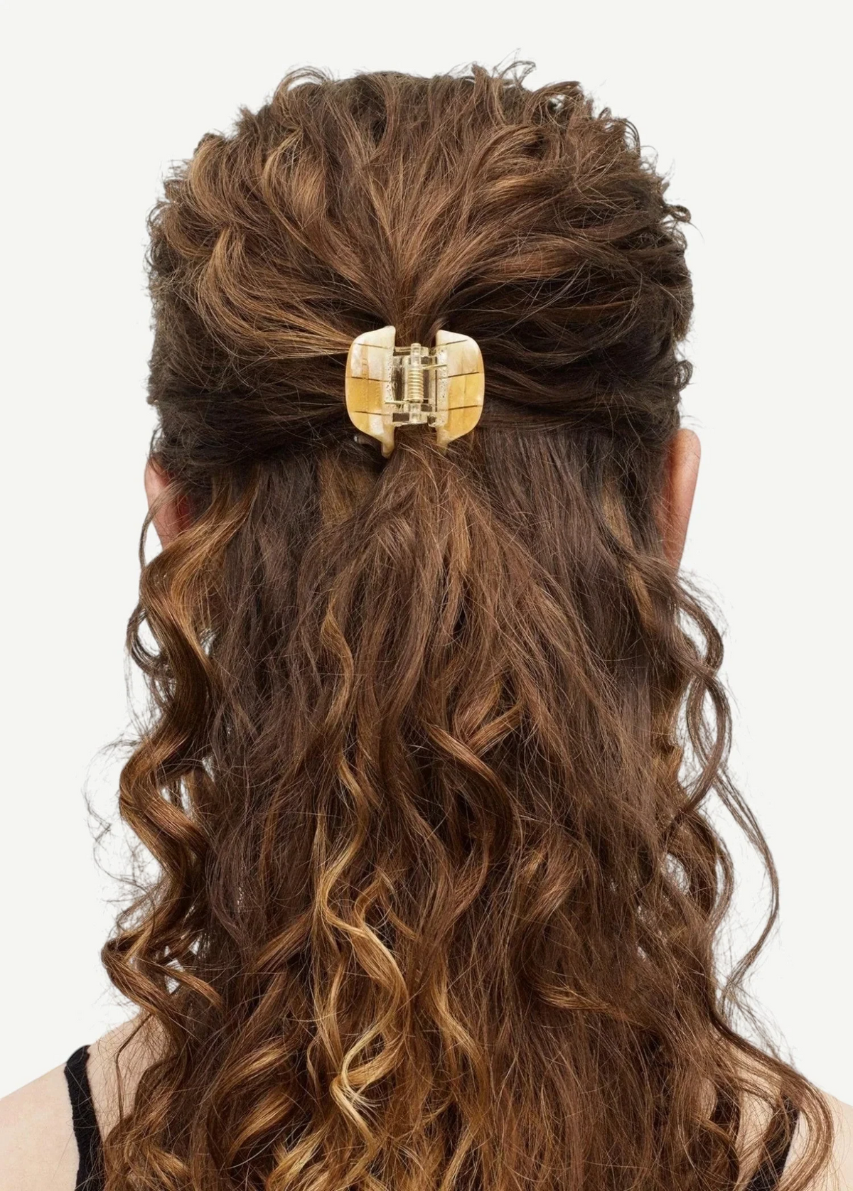 KABE SHOP INC mini claw hair clip in beige Italian bio-acetate holding curly hair in a half-up style