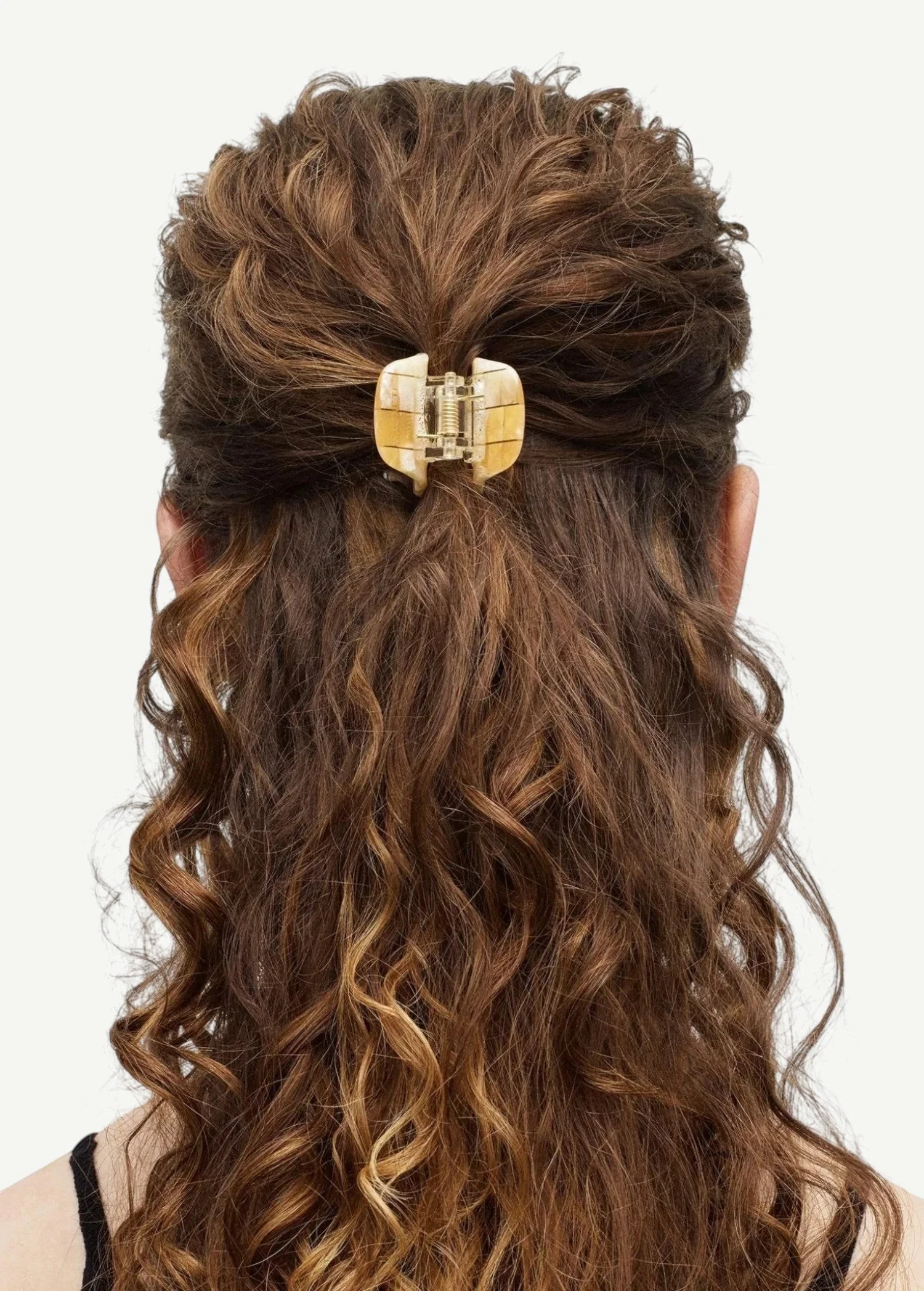 KABE SHOP INC mini claw hair clip in beige Italian bio-acetate holding curly hair in a half-up style
