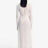 Back view of KABE SHOP INC Mirror Dress in sheer white fabric with silver embellishments and a tie-back waist.