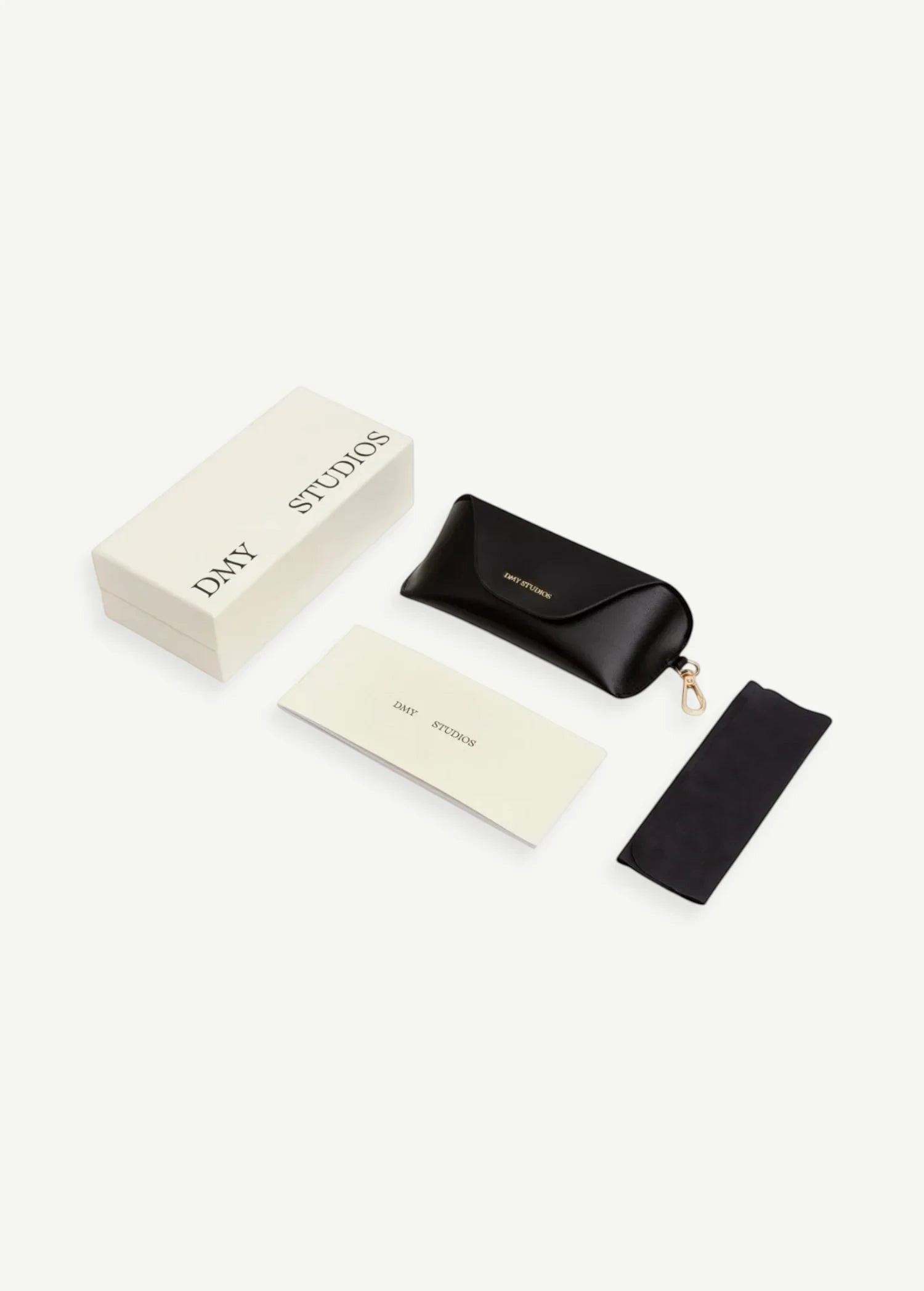 KABE SHOP INC Naomi sunglasses set including a black protective case, branded box, cleaning cloth, and information card.