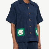 KABE SHOP INC navy organic cotton towelling boxy shirt with green and white handwoven crochet pocket detail
