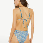 Model wearing KABE SHOP INC Onda Andri Tri blue floral print triangle bikini top and matching high-cut bottoms