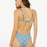 Model wearing KABE SHOP INC Onda Andri Tri blue floral print triangle bikini top and matching high-cut bottoms