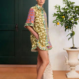KABE SHOP INC Patty shirt featuring a vibrant multi-colored floral print, relaxed fit, and ruffled hem details.