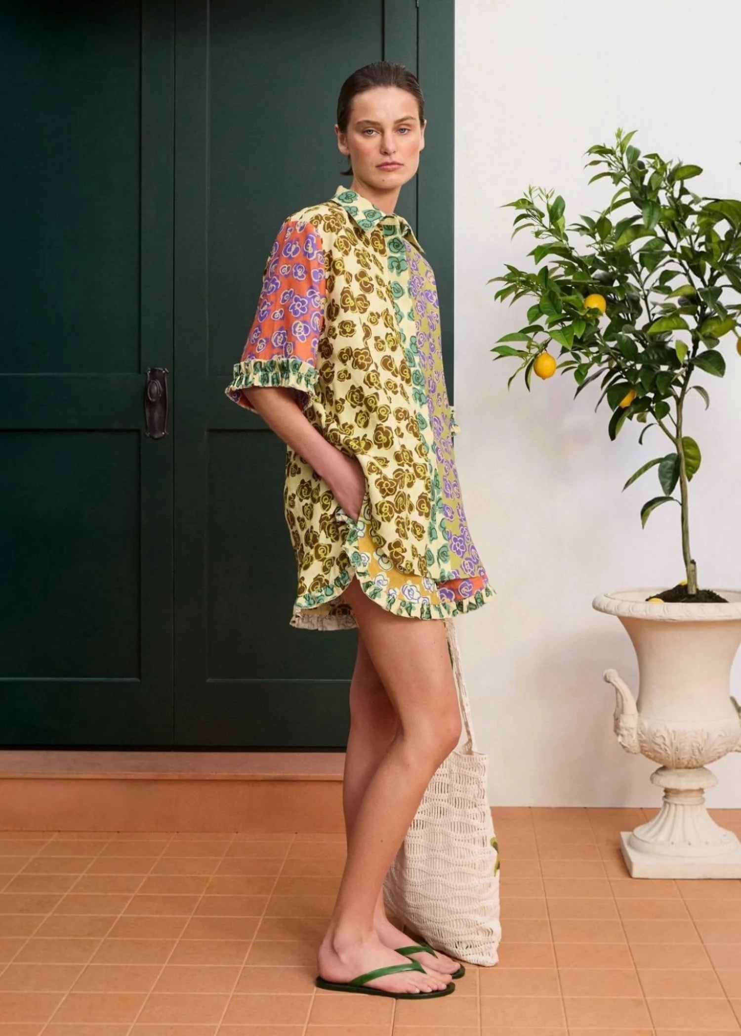 KABE SHOP INC Patty shirt featuring a vibrant multi-colored floral print, relaxed fit, and ruffled hem details.