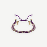 KABE SHOP INC N° 183 braided bracelet featuring purple cord woven with gold metallic thread and delicate tassels.