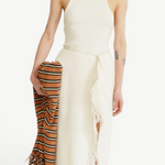 KABE SHOP INC Rayen dress in cream with a racerback neckline, side slit, and fringe detail, held with a striped scarf