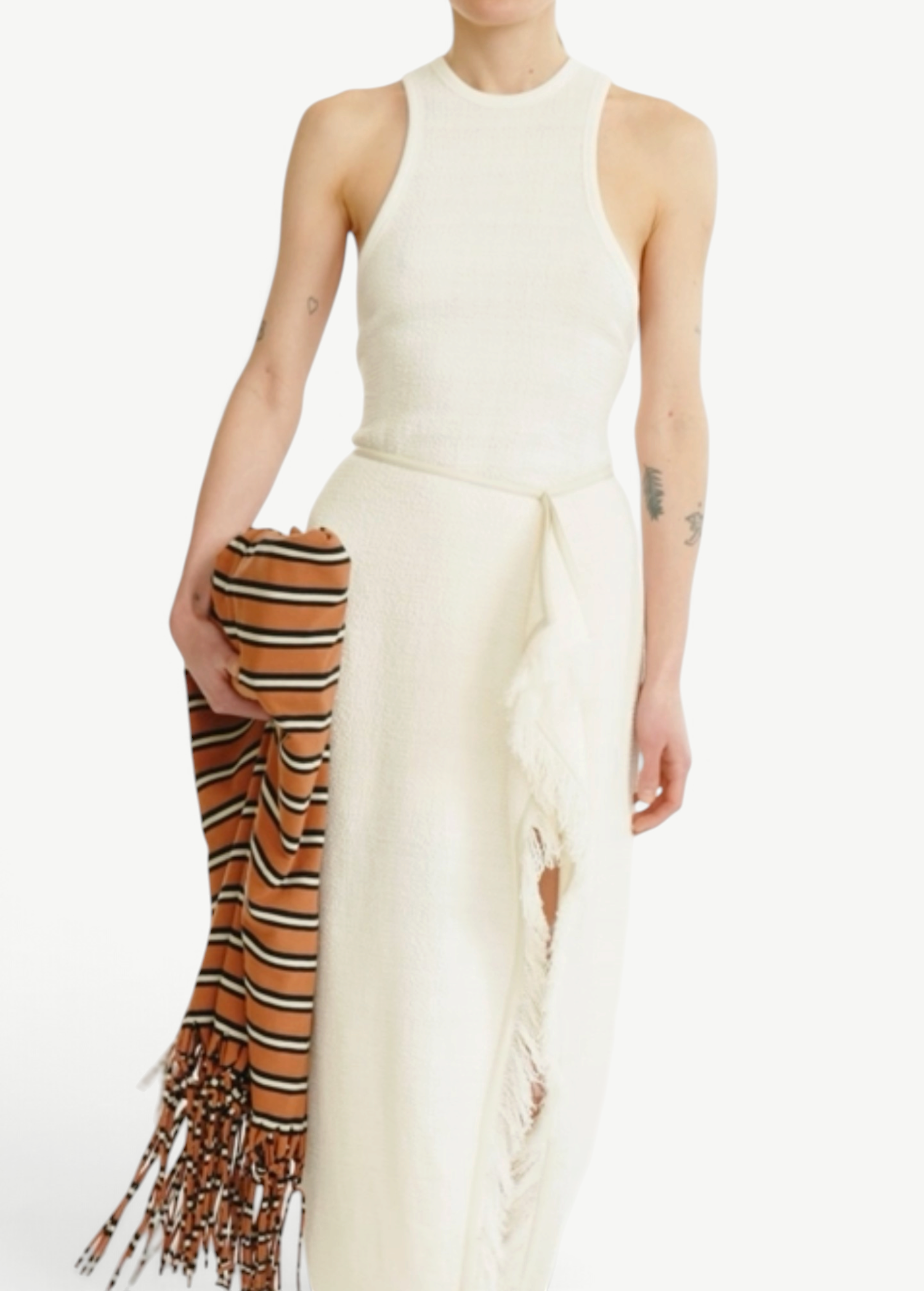 KABE SHOP INC Rayen dress in cream with a racerback neckline, side slit, and fringe detail, held with a striped scarf
