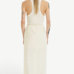 Back view of a woman wearing a KABE SHOP INC Rayen dress in cream with a racerback design and structured silhouette.
