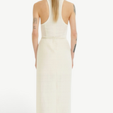 Back view of a woman wearing a KABE SHOP INC Rayen dress in cream with a racerback design and structured silhouette.