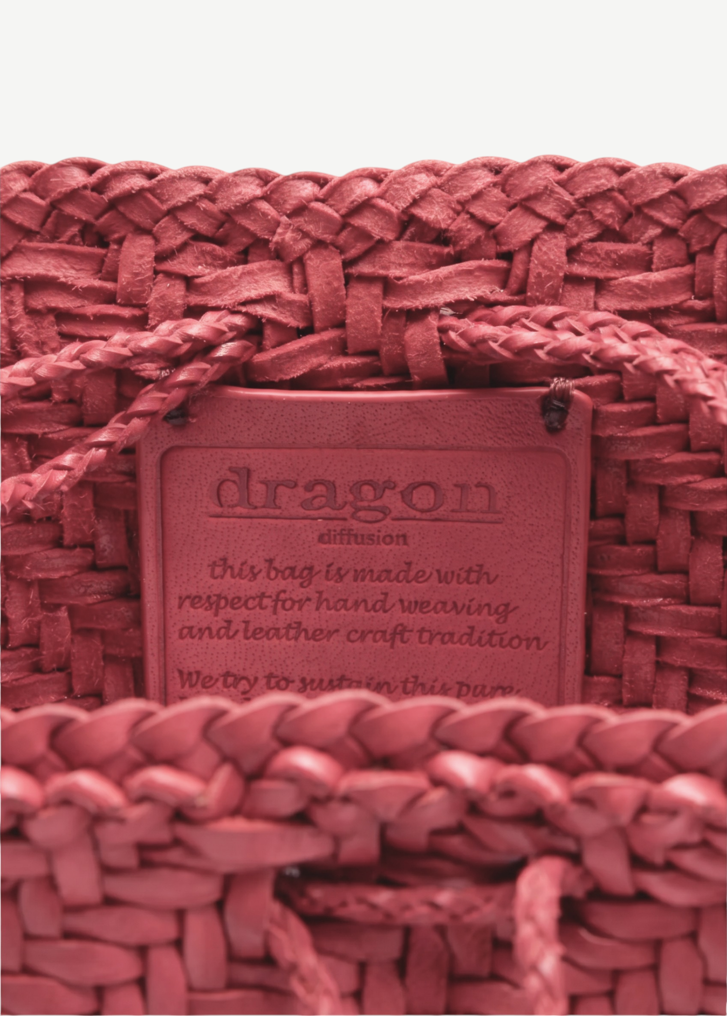 KABE SHOP INC Pompom Double Jump Bag in red woven buffalo calf leather with interior brand stamp detail