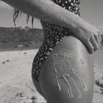 KABE SHOP INC Regatta one piece swimsuit in black and white geometric print worn on a sandy beach