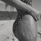 KABE SHOP INC Regatta one piece swimsuit in black and white geometric print worn on a sandy beach