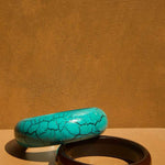 KABE SHOP INC resin bangle set featuring a turquoise crackle finish bracelet and a solid dark brown bangle
