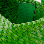 KABE SHOP INC Rosanna Bag in vibrant green handwoven buffalo leather with an interior artisan brand tag