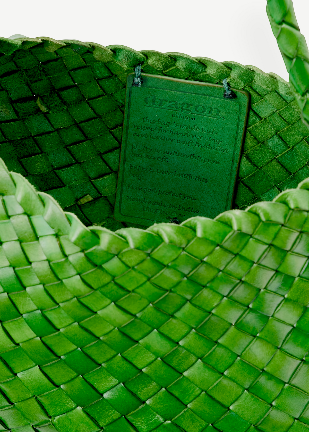KABE SHOP INC Rosanna Bag in vibrant green handwoven buffalo leather with an interior artisan brand tag