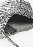 KABE SHOP INC Rosanna Bag in metallic silver handwoven buffalo leather with a detailed interior weave and shoulder strap