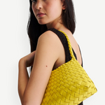 KABE SHOP INC Rosanna Bag in bright yellow handwoven buffalo leather with a sleek shoulder silhouette on a model