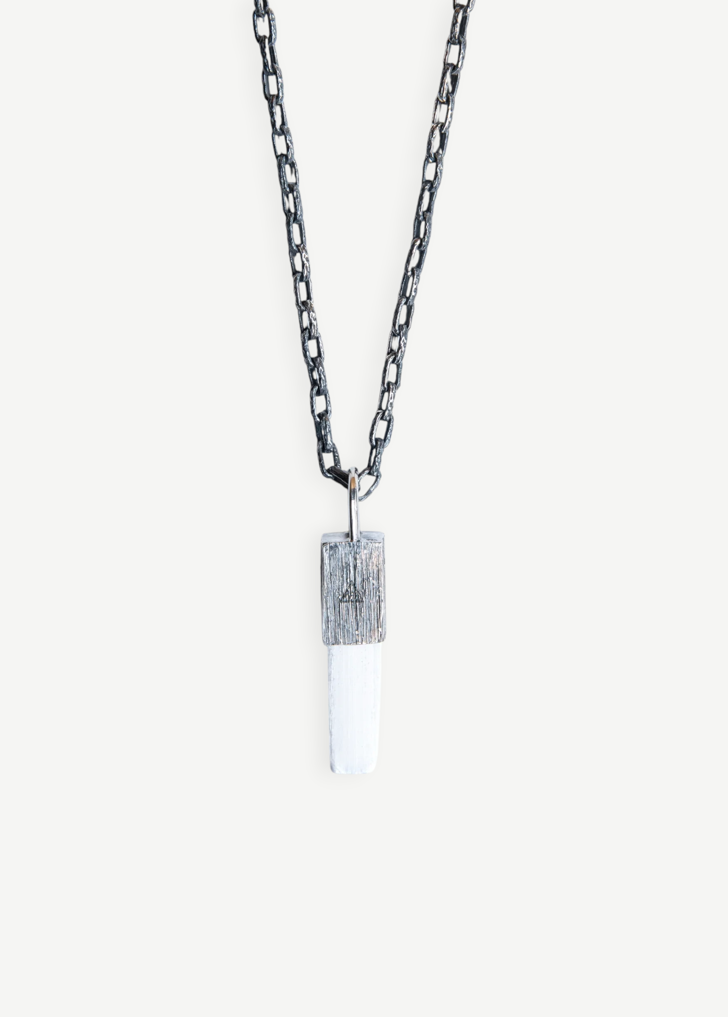 KABE SHOP INC Selenite necklace featuring a white crystal pendant with a textured silver cap on a dark chain