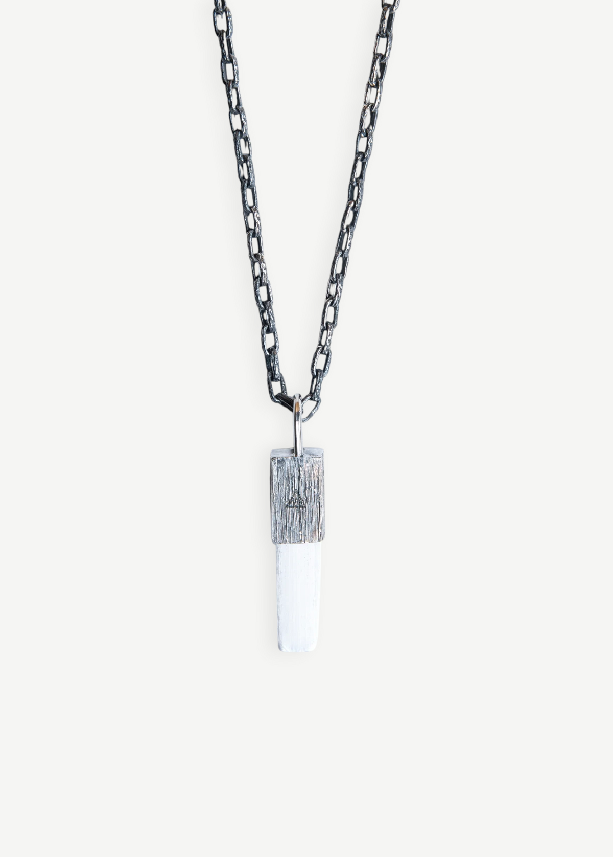 KABE SHOP INC Selenite necklace featuring a white crystal pendant with a textured silver cap on a dark chain